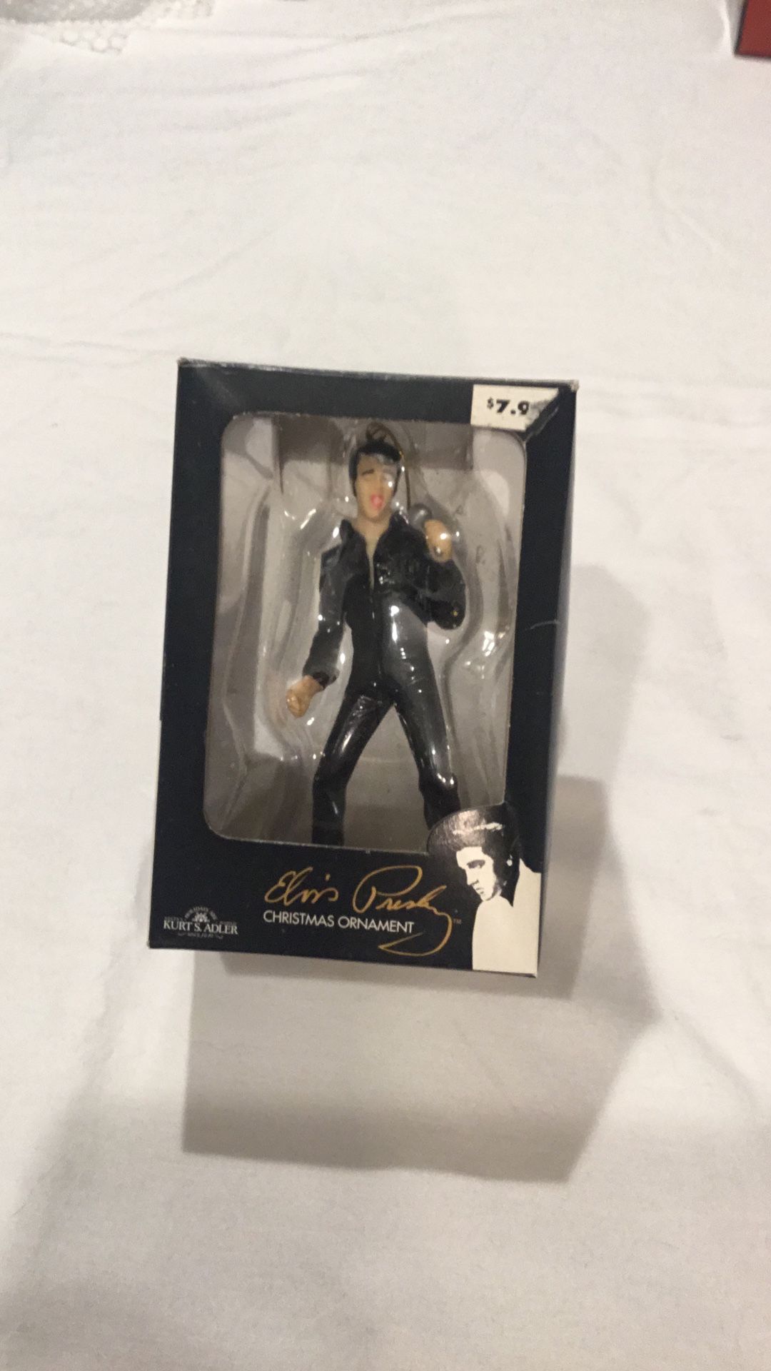 Elvis In Black Jumpsuit. Holding Microphone