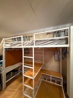 Twin size white metal frame loft bed with desk