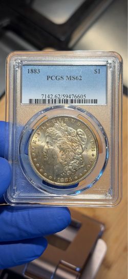 1883 RAINBOW TONED MORGAN SILVER DOLLAR PCGS