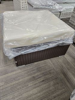 Outdoor Wicker Ottoman with Cushion. 2 available