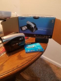 Dvd camera with disc and battery charger