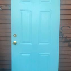 PUERTA DE MADERA FORRADA DE METAL 