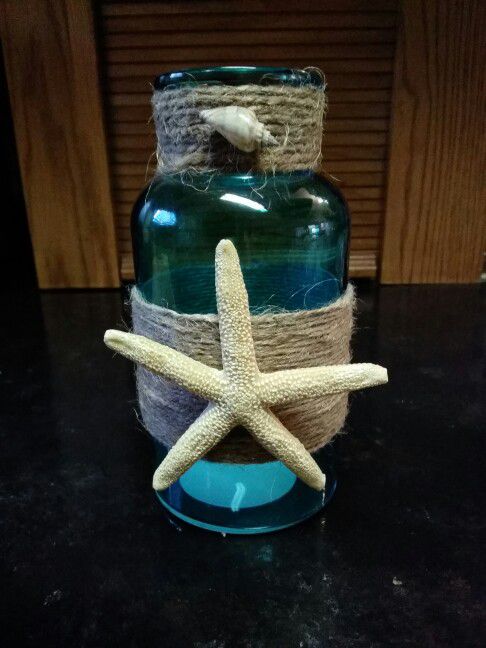 Aqua blue glass vase with starfish
