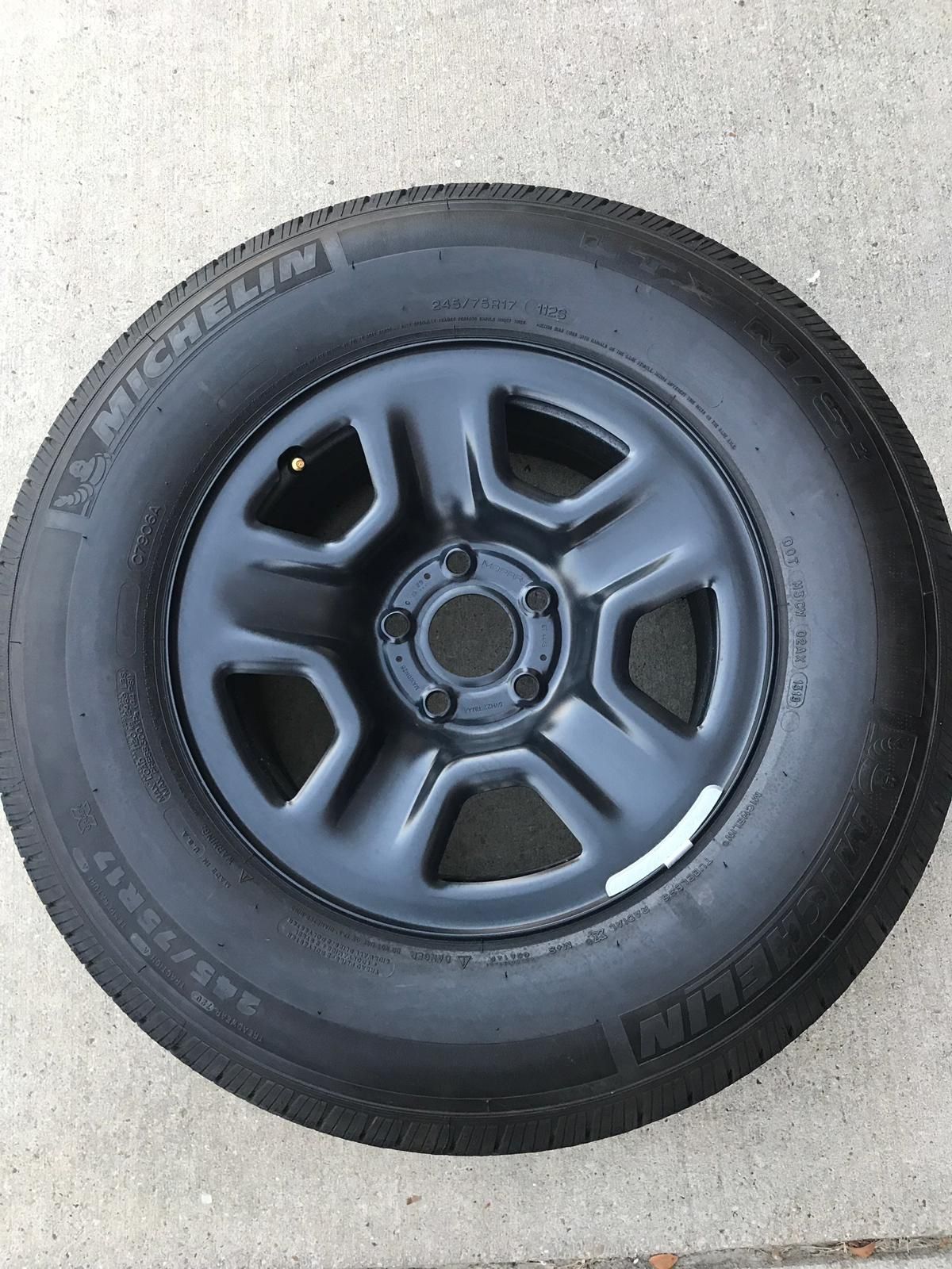 Brand new JL Jeep Wrangler spare wheel with tire.