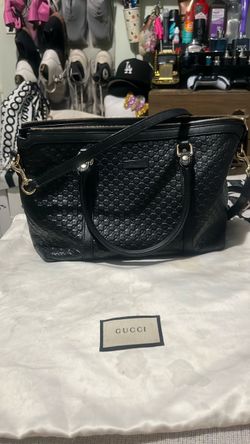 This item is an authentic Gucci Microguccissima Leather Bree (or Margaux) Top Handle Tote Bag in black.