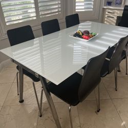 Glass Table With 6 Black Chairs