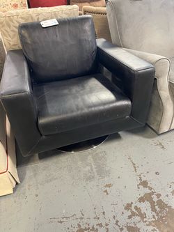 Black leather or faux leather chair (in store)