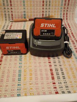 Stihl 2 battery's ak47 and a charger for a Stihl electric mower
