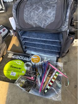 Fishing trolley case, fishing tackle, fishing line, and sinkers.
