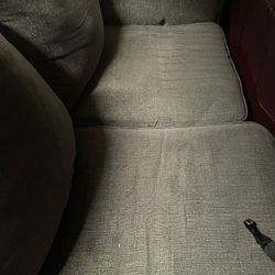 Grey couch with ottoman
