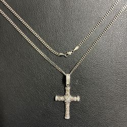 Stainless steel cross pendant with chain .