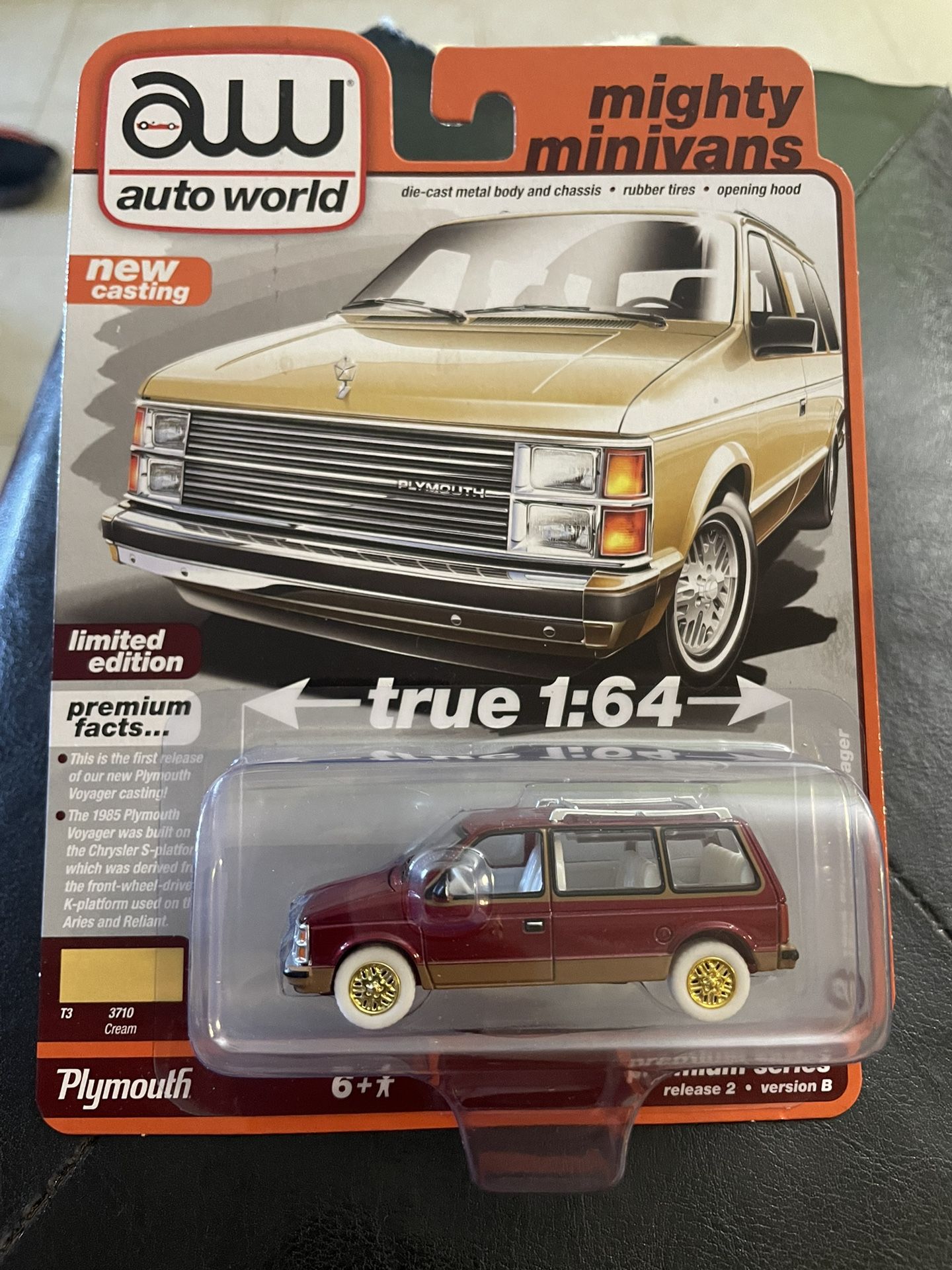 Autoworld Ultra Red Chase 1985 Plymouth Voyager Van