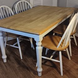 Wooden table and 4 chairs 
36 x 59.5 inches & 29.5 Height 
Chairs are a little loose /wobbly  but still hold well, table is in good Clean condition So