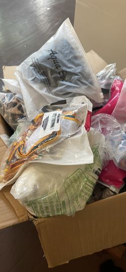 A box of misc brand new bathing suits. 16 items in the box.
