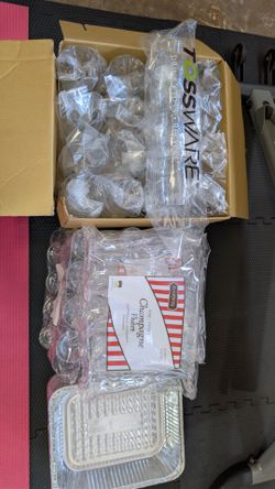 Huge lot of party supplies (cups, cutlery, champagne flutes, serving trays, etc )