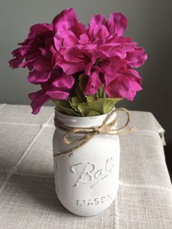 Distressed mason jar vase with silk flowers