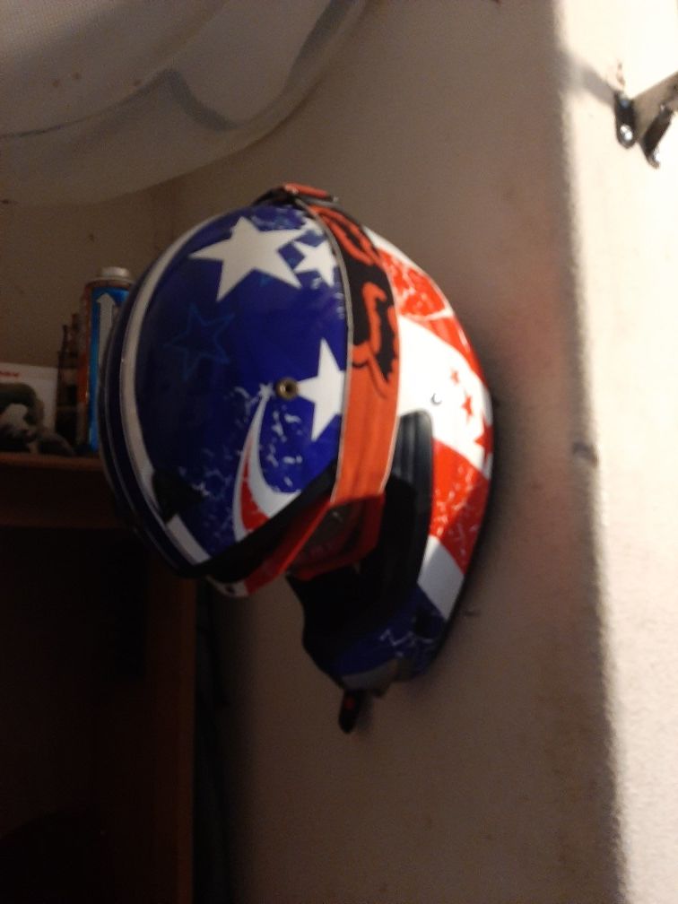 Motorcycle helmet wall hanger
