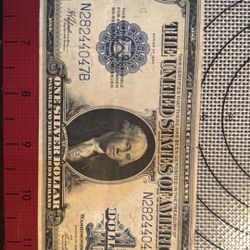 This is a 1923 series one dollar Silver Certificate. (Big Note)