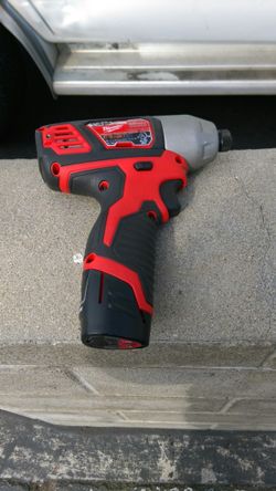 M12 Milwaukee impact gun with charger