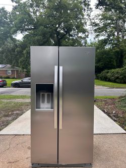 Stainless steel whirlpool refrigerator side by side with ice and water thru door