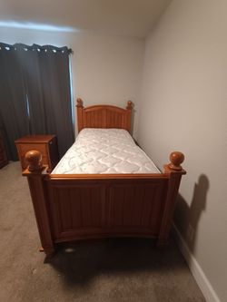 Wood single size bed, dresser, nightstand, extra drawers under bed