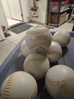 Gold dot softballs, never used