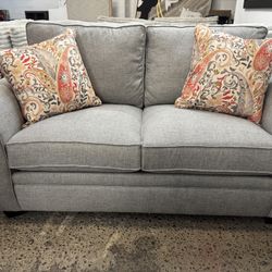 Gray Loveseat With Accent Pillows