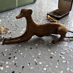 Metal greyhound dog statue