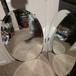 Two Oval Mirrors