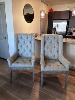 Two Matching Captain Chairs