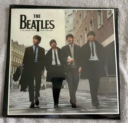 2 Beatles Calendars  1)2015 16-month calendar 2) 2016 Calendar featuring a black & white photograph