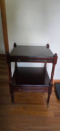 Table with draw and writing shelf and weels 24 high 17 wide 15 deep with shelf out 31