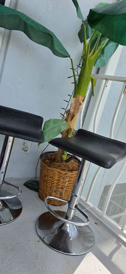 Pair of Black and Chrome Adjustable Bar Stools