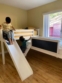Two twin loft beds with slides