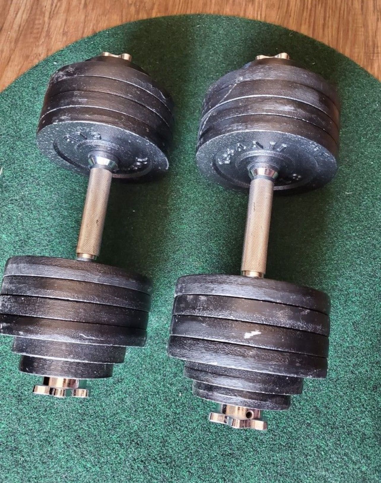 52.5 lbs. X 2 adjustable dumbells 105 lbs. Total