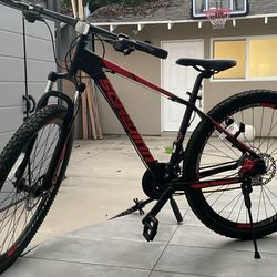 Schwinn Bonafide Men and Women Mountain Bike, Front Suspension, 24-Speed, 29-Inch Wheels, 17-Inch Aluminum Frame, Matte Black/Red