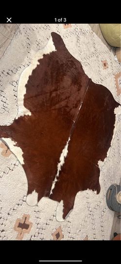 cowhide rug (roughly 5.5’x5.5’)