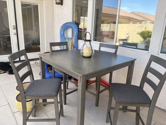 Gray bar top dining table and 4 chairs
