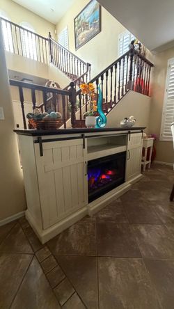 White cabaret fireplace/tv stand in excellent condition 78"