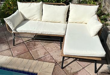 Two piece outdoor BoHo wicker patio L-shaped sectional sofa with cushions beige