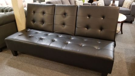Brand new  78" x 45" black faux leather sofa futon with cup holders
