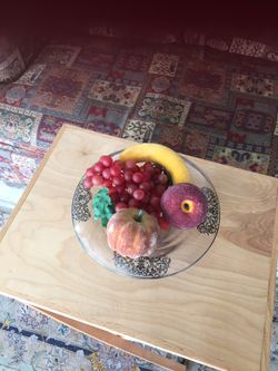 An antique bowl with a sterling silver design in Side the glass