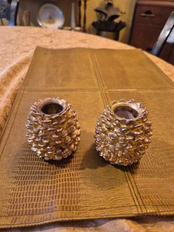 Two Department 56 gold tone pine cone candle holders