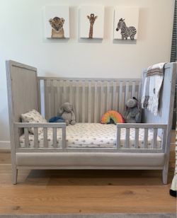 RH Jeune upholstered panel crib with a toddler conversion kit and Naturepedic organic mattress