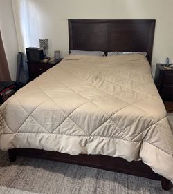 Queen bed with mattresses and night stand