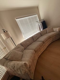 Large sectional couch plus 2 matching chairs and ottomans.