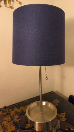 Blue shade lamp with outlet