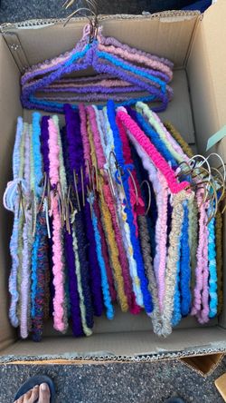Old school metal hangers with hand crocheted covering. Box full