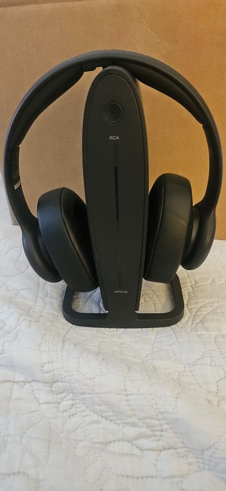 Insignia RF Wireless Over-the-Ear Headphones with their charging and transmitter dock