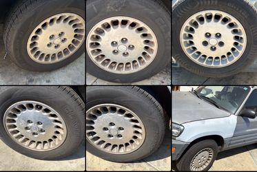 Five Matching 16 Inch aluminum rims and Good tires 5x114.3mm Infiniti, Nissan, Toyota, Honda, and More